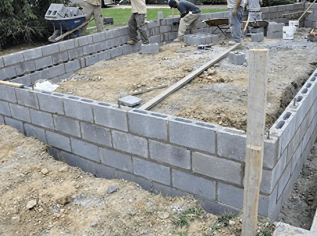 Professionals building a foundation with blocks in Salt Lake City, UT